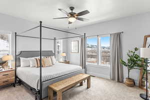 Bedroom with ceiling fan and carpet floors