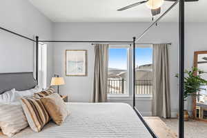 Carpeted bedroom with ceiling fan