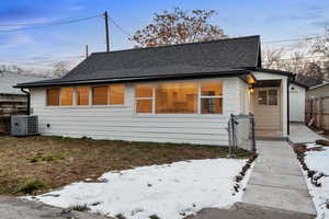 View of front of home featuring central AC unit