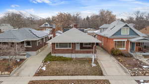 Bungalow-style house featuring a porch and a mountain view