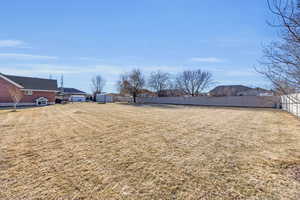 View of yard with a storage shed