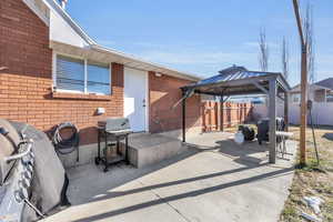 View of patio / terrace featuring a gazebo and grilling area