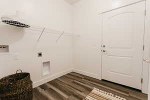 Washroom featuring washer hookup, dark hardwood / wood-style floors, and hookup for an electric dryer