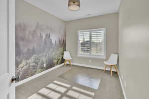 Sitting room featuring carpet flooring