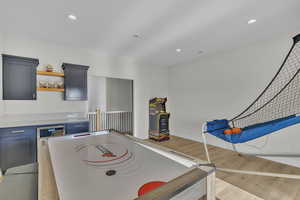 Playroom with light hardwood / wood-style floors