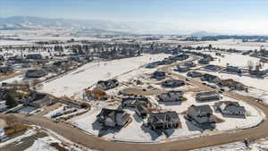 Snowy aerial view with a mountain view