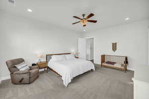 Bedroom featuring ceiling fan and light carpet