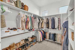 Walk in closet featuring carpet