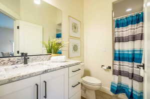 Bathroom featuring toilet and vanity