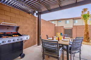 View of patio / terrace featuring a pergola and a grill