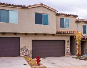 Mediterranean / spanish-style home featuring a garage