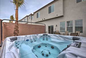 Exterior space with a hot tub