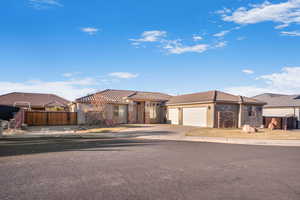 Mediterranean / spanish house featuring a garage