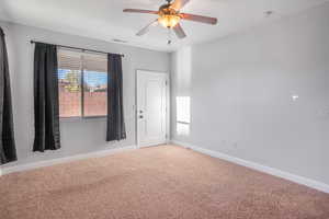 Unfurnished room with carpet and ceiling fan