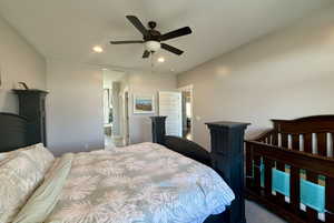 Carpeted bedroom featuring ceiling fan