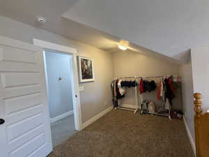 Interior space featuring dark colored carpet