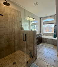 Bathroom featuring independent shower and bath, tile patterned flooring, and vanity