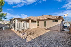 Rear view of property with a pergola