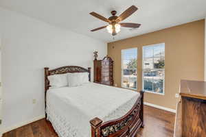 Bedroom #2 featuring ceiling fan and dark hardwood / wood-style flooring