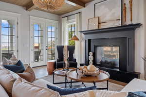 Interior space with wood ceiling, beamed ceiling, and light hardwood / wood-style flooring