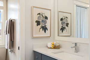 Bathroom with vanity and a wealth of natural light