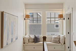 Sitting room featuring a healthy amount of sunlight