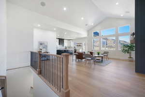 Interior space featuring high vaulted ceiling and light wood-type flooring