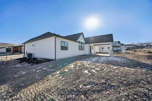 Exterior space featuring central AC unit and a mountain view