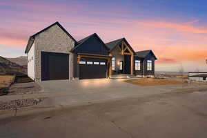 Modern farmhouse style home featuring a garage and a mountain view