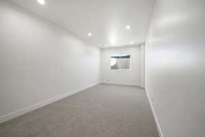 Unfurnished room featuring carpet floors