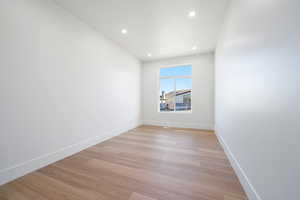 Spare room with light wood-type flooring