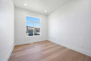 Empty room featuring light hardwood / wood-style flooring