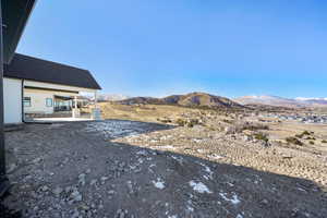 View of yard with a mountain view and a patio