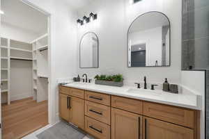 Bathroom with vanity and tile patterned flooring