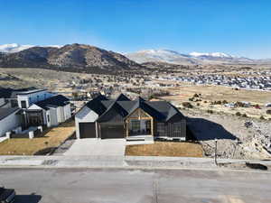 Exterior space with a garage and a mountain view