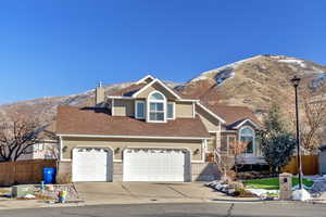 View of front of house featuring a garage and a mountain view