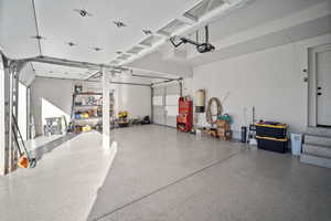 Garage featuring a garage door opener