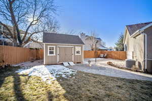 Exterior space with central AC and a lawn