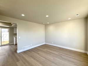 Spare room featuring light hardwood / wood-style flooring