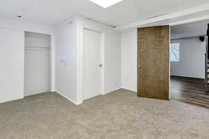 Bedroom with carpet and a closet