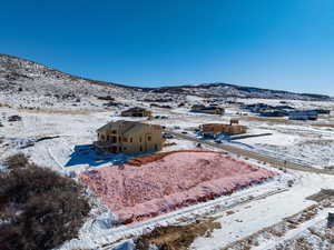 Snowy aerial view featuring a mountain view