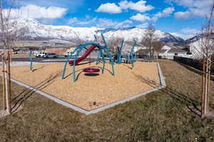 View of playground close by.  Featuring a mountain view