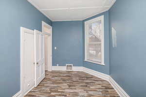 Empty room with wood-type flooring