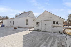 Rear view of property with a shop