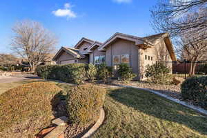 Ranch-style home with a front yard