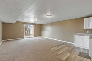 Unfurnished room featuring a textured ceiling