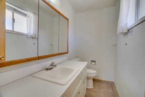 Bathroom with toilet and vanity