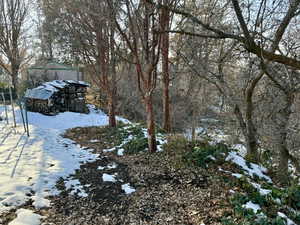 View of yard covered in snow