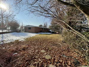 View of yard covered in snow