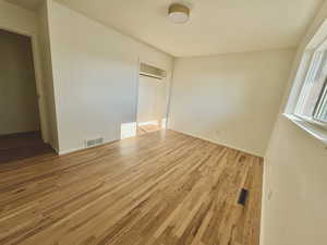 Bedroom 2 featuring a closet and light hardwood / wood-style floors